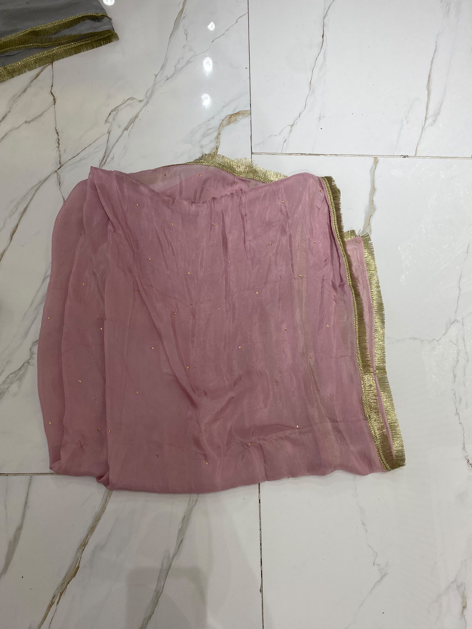 A rose pink ensemble with a rectangular embroidered chest panel and…