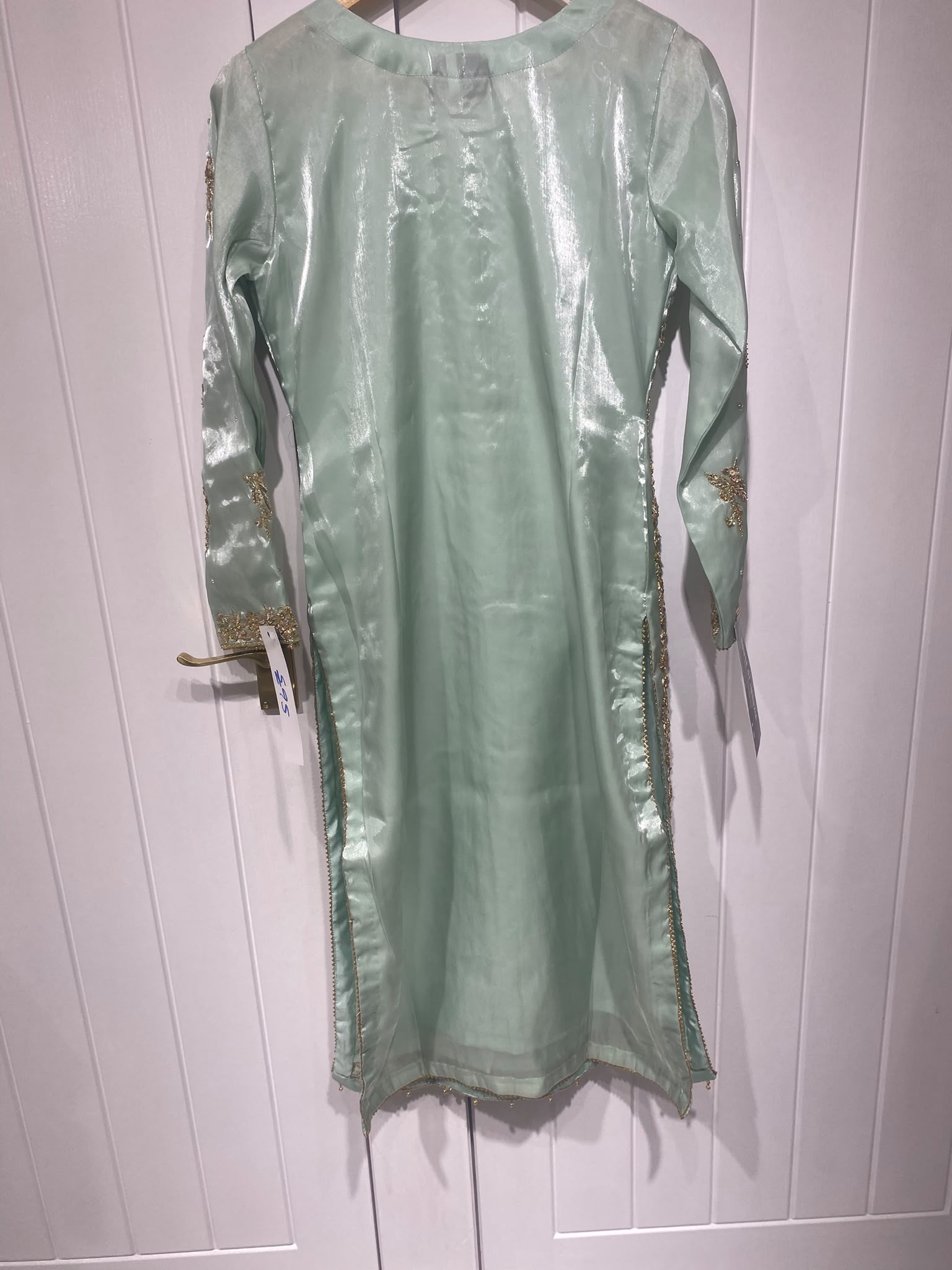 An aqua mint ensemble with a wide embroidered floral yoke, scattered…