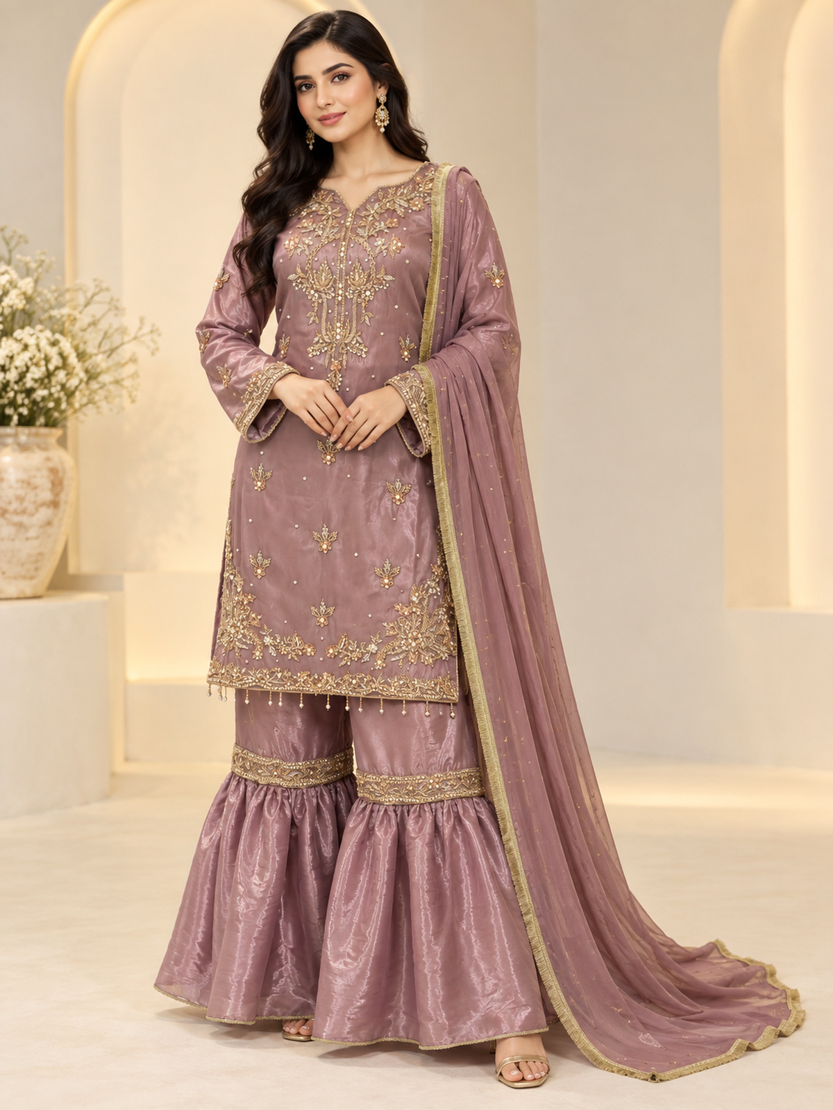 A dusty mauve ensemble with floral neckline embroidery, tiered…