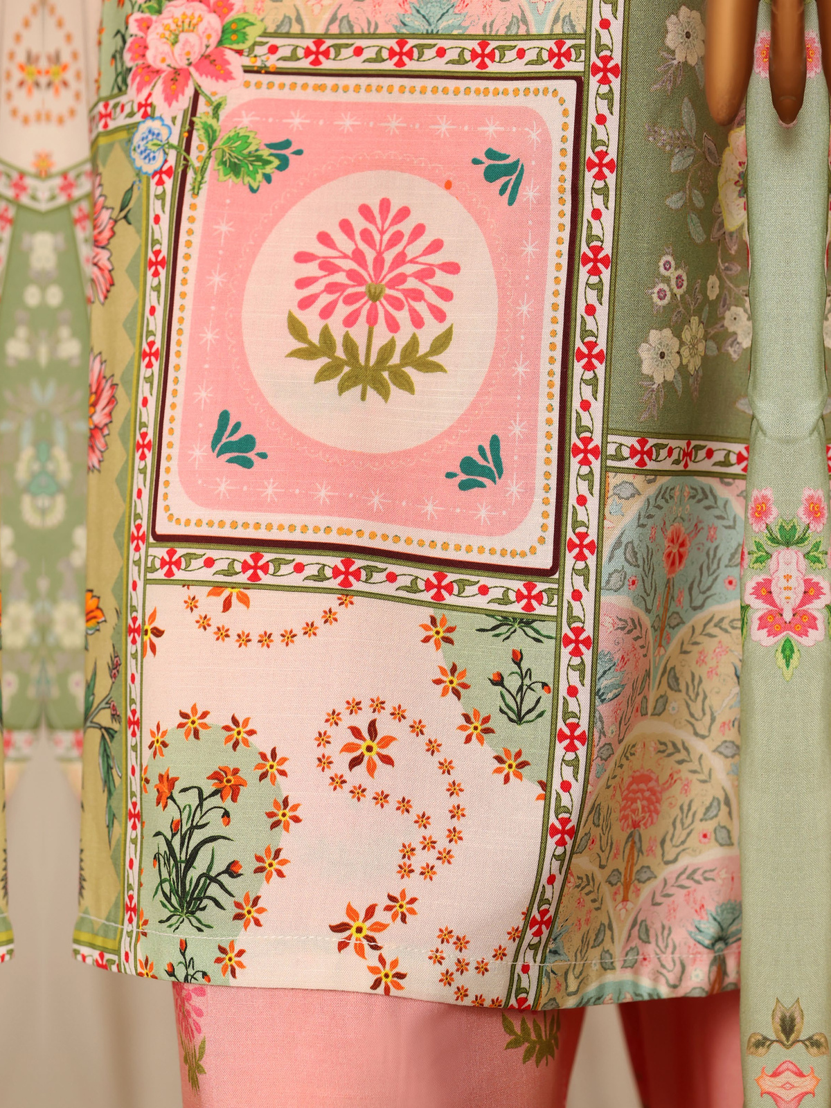 A multicolour patchwork-style floral shirt with pink printed trousers…