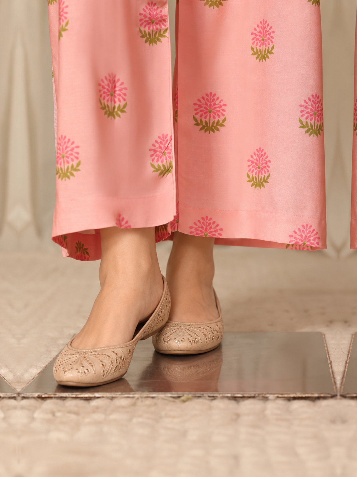 A multicolour patchwork-style floral shirt with pink printed trousers…