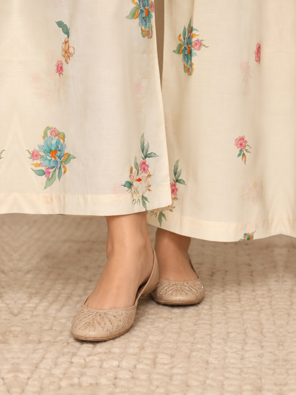 A sage-green shirt with pale botanical motifs, cream floral trousers…