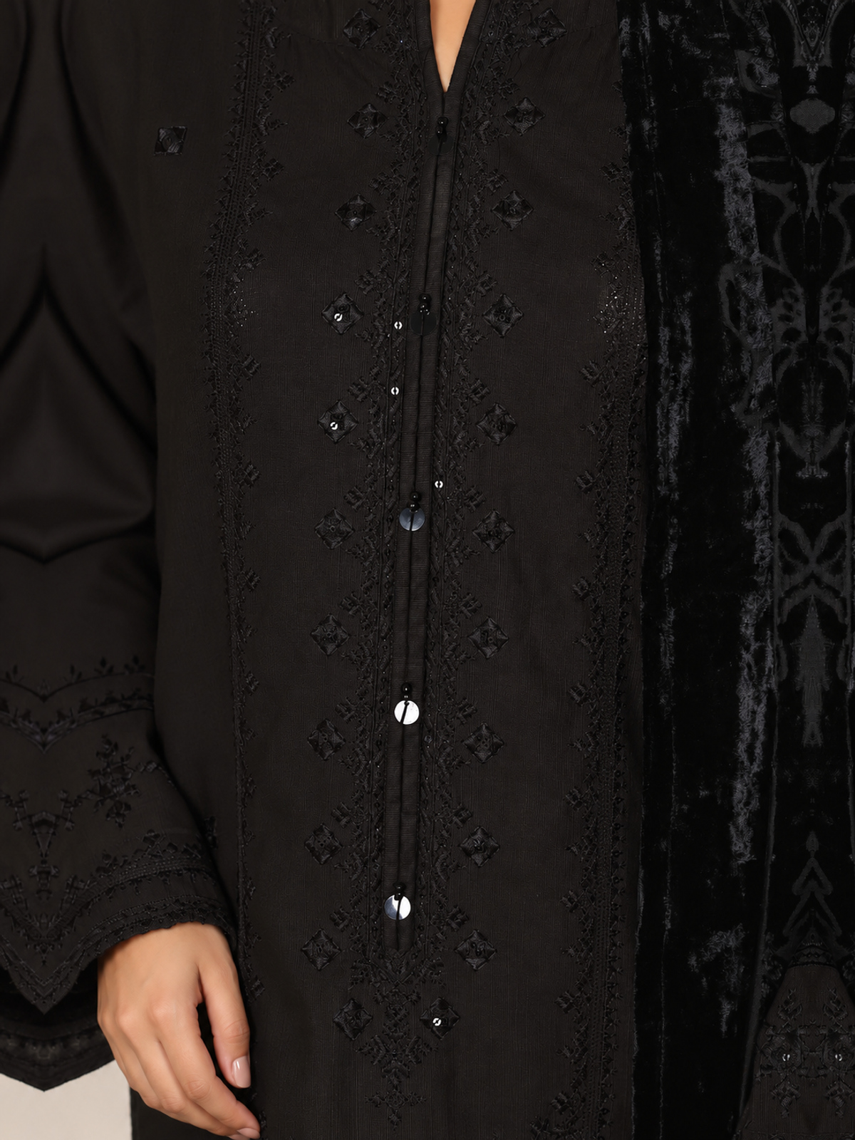 A black ensemble with tonal embroidery, matching trousers and a black…