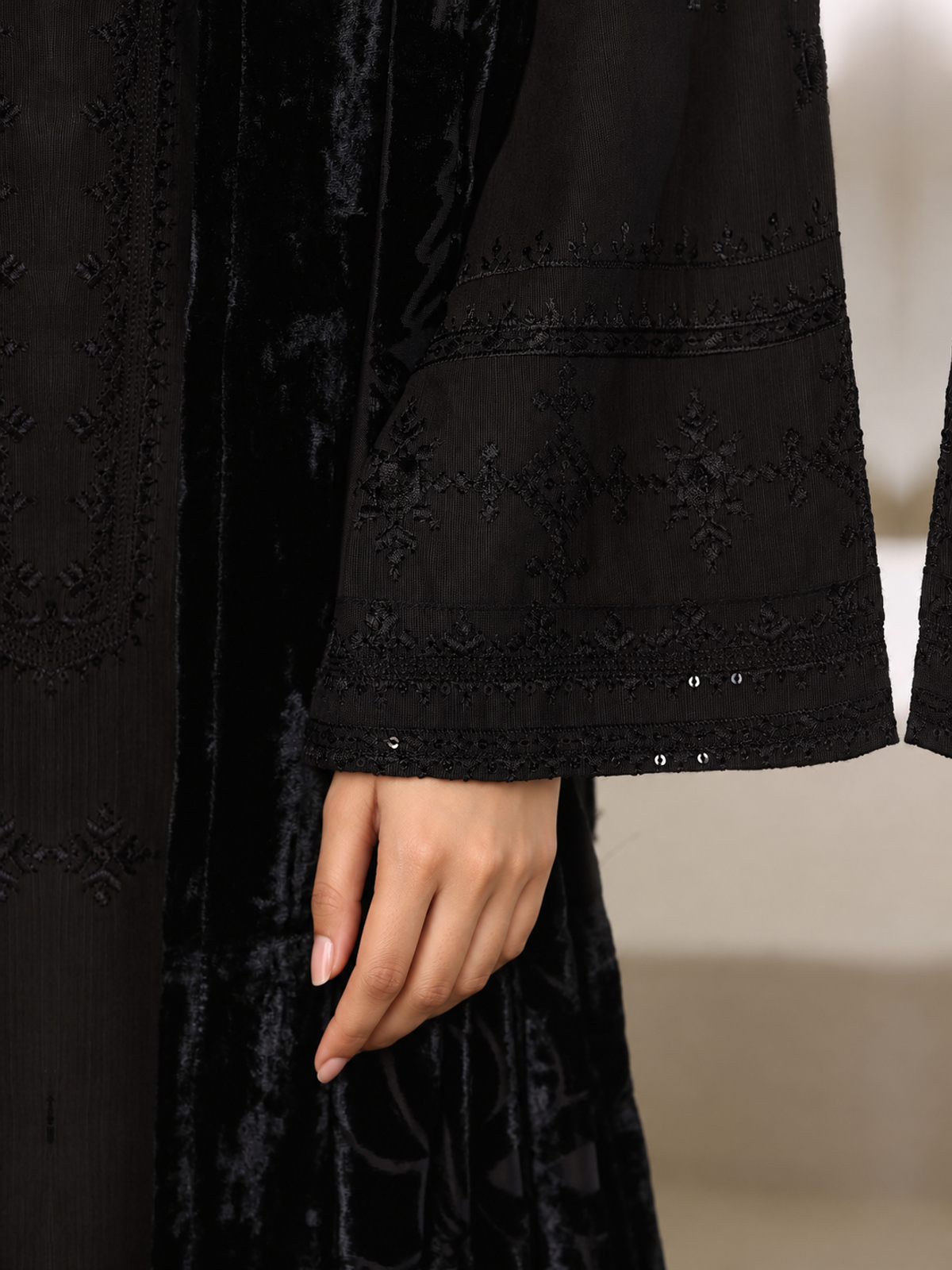 A black ensemble with tonal embroidery, matching trousers and a black…