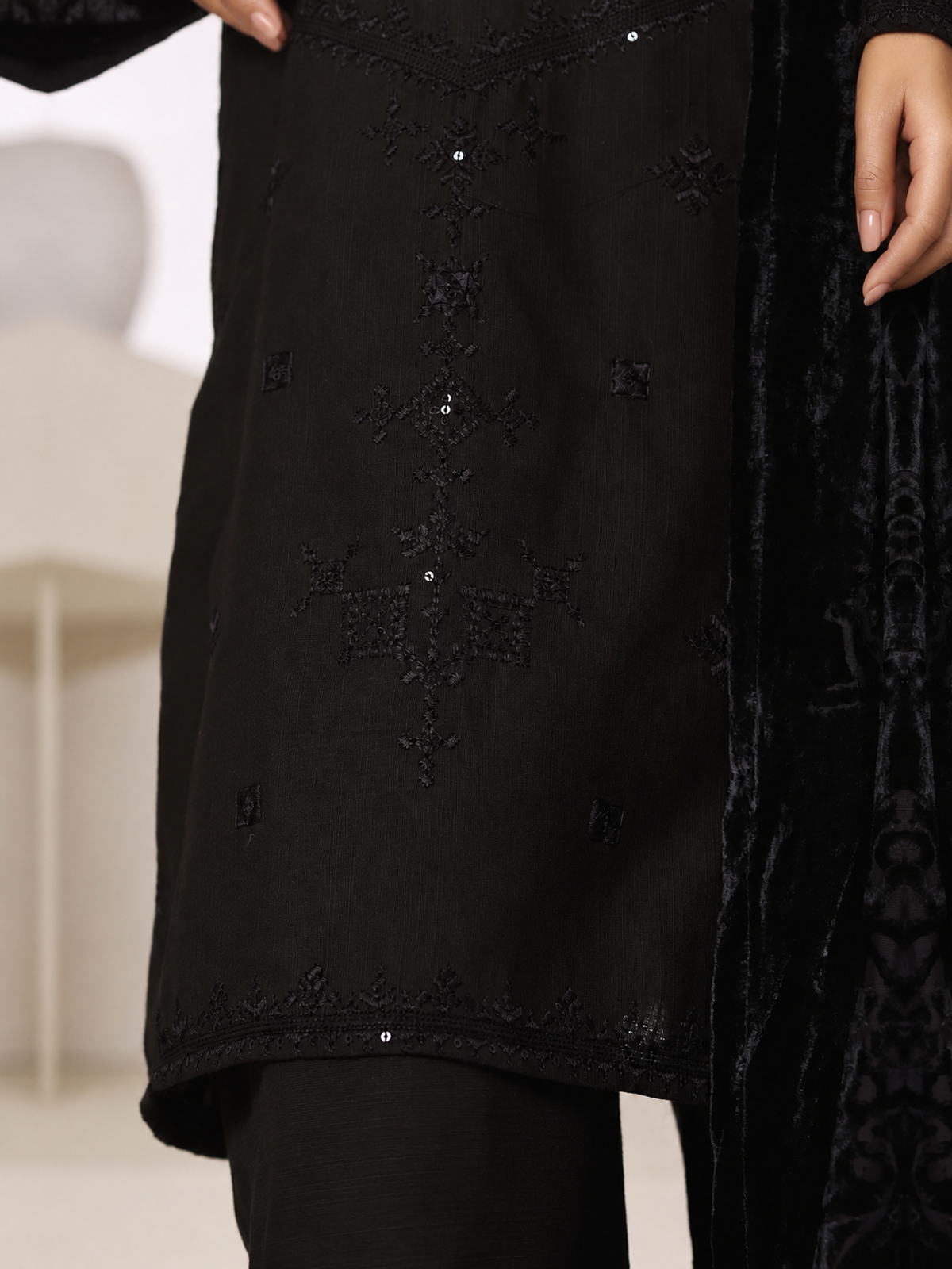 A black ensemble with tonal embroidery, matching trousers and a black…