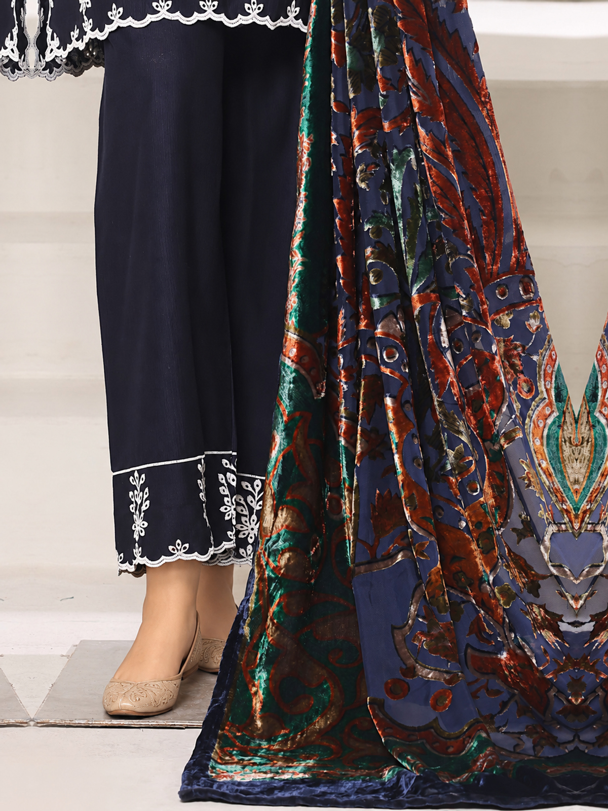 A navy ensemble with contrasting pale embroidery, matching trousers…