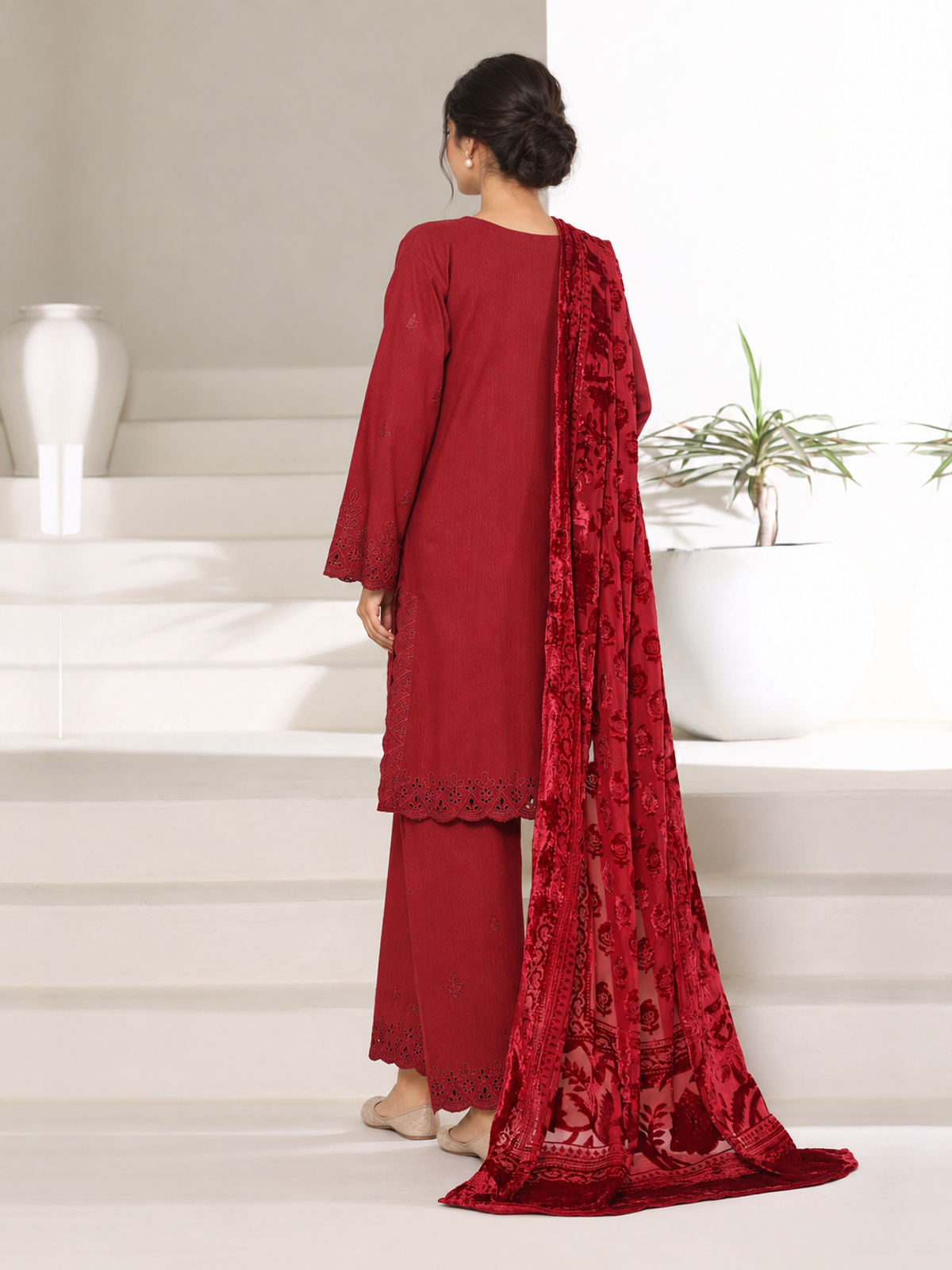 A deep-red ensemble with tonal floral embroidery, matching trousers…