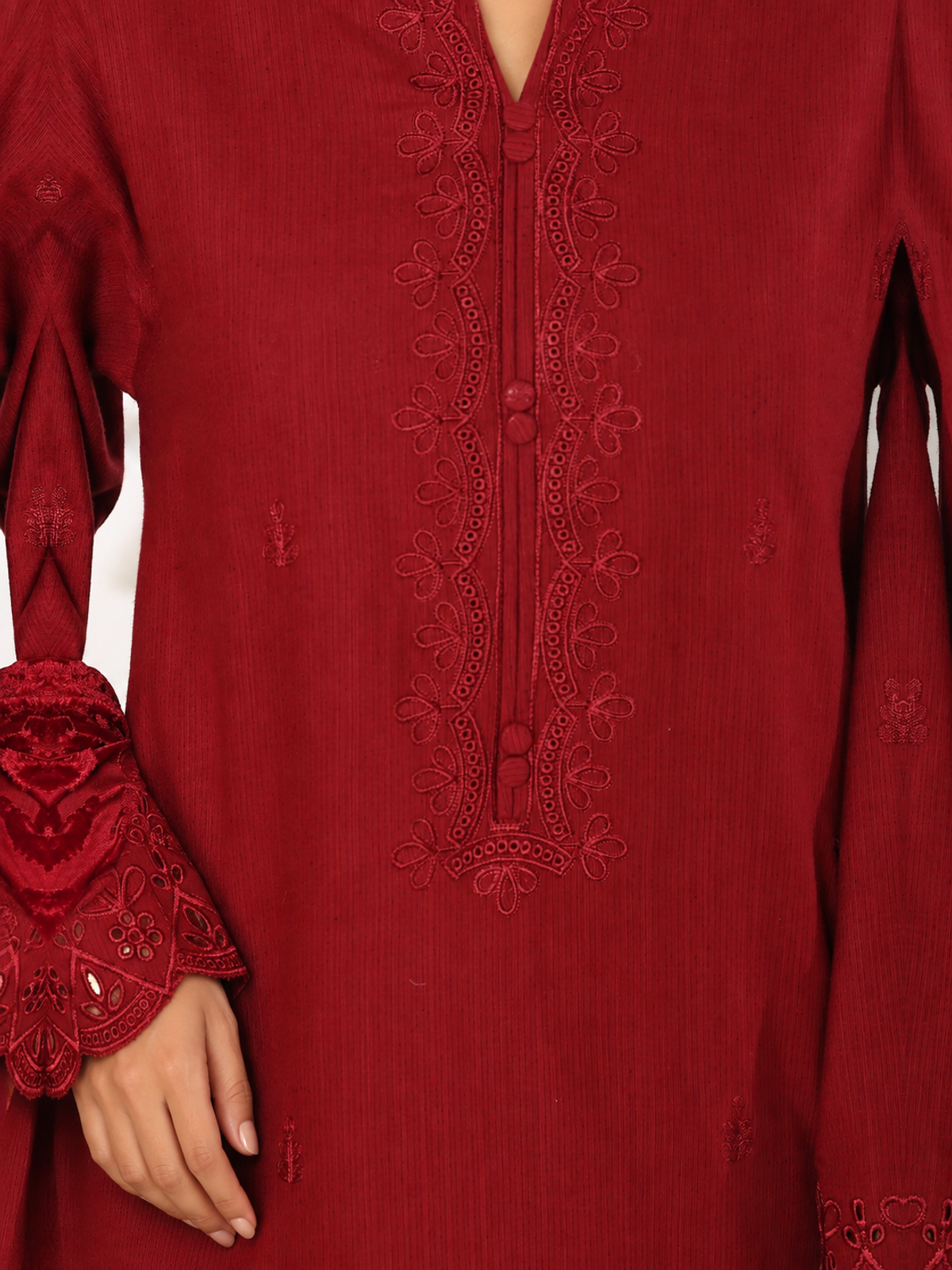 A deep-red ensemble with tonal floral embroidery, matching trousers…